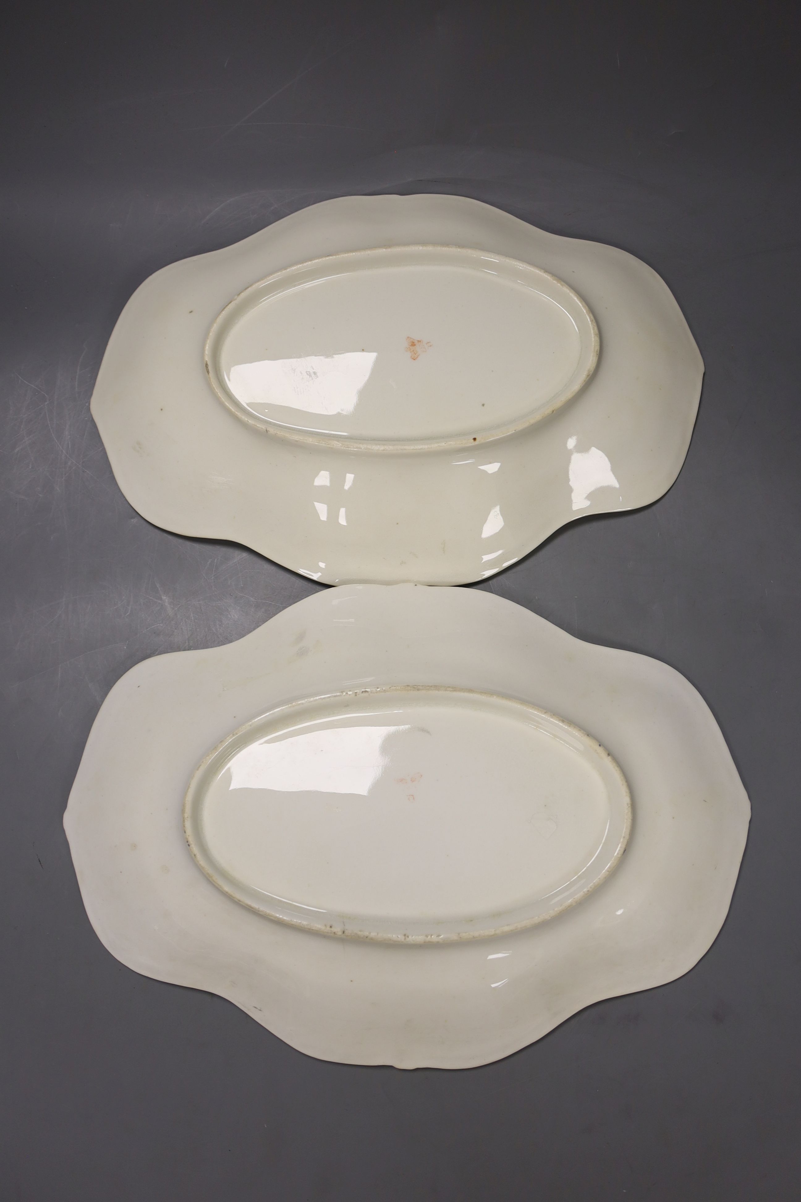 A pair of Crown Derby oval dishes, painted with four floral panels, c.1825, length 31cm
